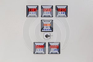 Digital voltmeter, amp meter and signal lamp on control panel of power plant.