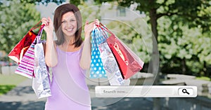 Digitally composite image of woman holding shopping bag and a search bar