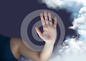 Digitally generated image of hand next to cloud