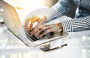 Digitizing all her ideas. Closeup shot of an unrecognizable businesswoman working on a laptop in an office.