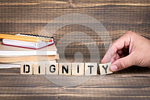 Dignity business concept. Wooden letters on the office desk