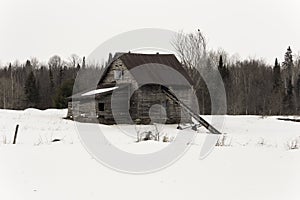 Dilapidated barn in a winter scene