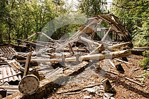 Dilapidated building with reinforced concrete columns and broken slate