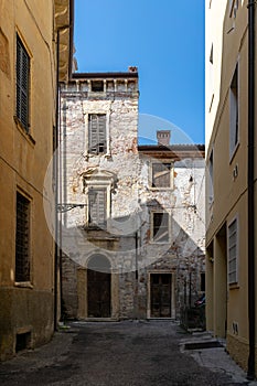 Dilapidated buildings with broken shutters in Verona