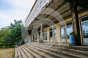 Dilapidated facade. Abandoned old soviet building