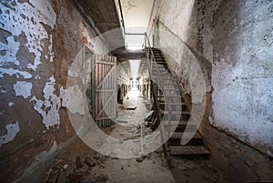 Dilapidated hallway and stairs at Eastern State Penitentiary