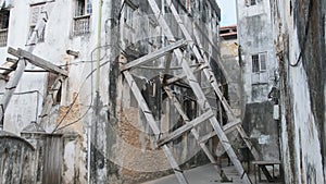 Dilapidated Old Houses Supported by Wooden Beams in Stone Town, Zanzibar, Africa