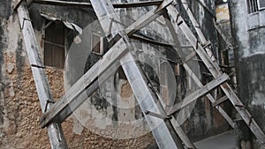 Dilapidated Old Houses Supported by Wooden Beams in Stone Town, Zanzibar, Africa