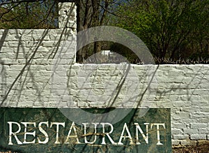 A dilapidated old Restaurant sign