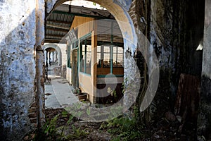 Dilapidated vintage corridor in the abandoned tin mining town of Jalan Papan in the outskirts of the city of Pusing, Perak, Malays