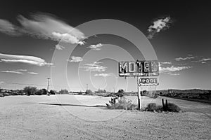 A dilapidated, vintage motel sign in the desert of Arizona