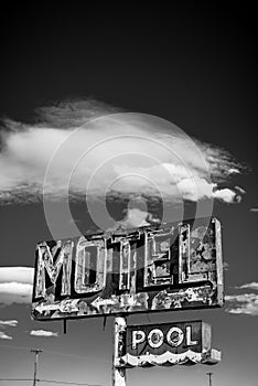 A dilapidated, vintage motel sign in the desert of Arizona