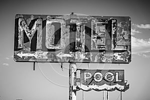 A dilapidated, vintage motel sign in the desert of Arizona