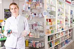 Diligent positive female druggist