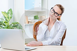 Diligent woman sitting at the table