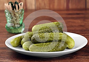 Dill Pickles on a plate, close up.