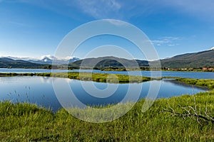 Dillon reservoir at sunrise, reflection of trees in water