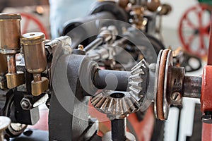 Oblique gears of the mechanism close-up. Ancient technologies. The era of steam engines.