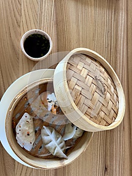 Dim-sam asian chineese dumpling pelmeni close up in food truck festival