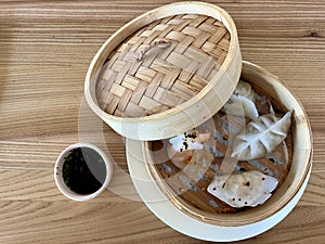 dim sam Traditional Chinese dishes steam dumplings, hot salads, snacks Dam Sam. Top view. Copy space 4 types with