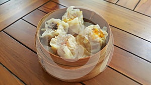 Dim Sum in bamboo steamed bowl on the table