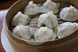 Dim sum dumpling on bamboo basket , Chinese food