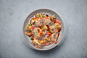 Dim Sum Pork Spare Ribs or Pai Guat in gray bowl on concrete table top. Chinese cantonese cuisine steamed spareribs dish photo