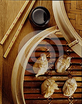 Dim Sum Steamed dim sum dumplings served with soy sauce photo