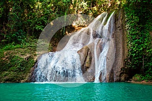 Dimiao Twin waterfalls in a mountain gorge in the tropical jungle of the Philippines, Bohol