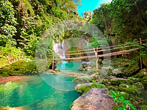 Dimiao Twin waterfalls in a mountain gorge in the tropical jungle of the Philippines, Bohol