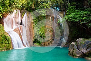 Dimiao Twin waterfalls in a mountain gorge in the tropical jungle of the Philippines, Bohol