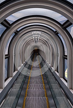 Diminishing perspective in a futuristic escalator tube