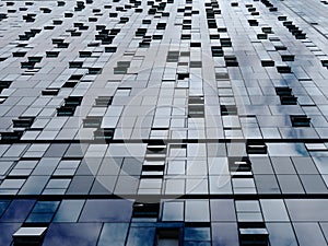 Diminishing perspective of modern building wall and windows.  Abstract metallic background.