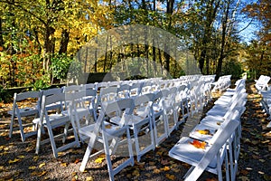 Diminishing perspective view of the wedding party with white colour outdoor chairs