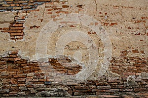 Dimly lit old brick wall texture blackground.
