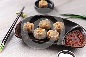 Dimsum is a Chinese Traditional Food, One of Varian Dimsum is Shicken Shiu May, serve with Chili Oil and Mayonaise