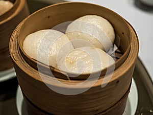 Dimsum Hagao in chinese bamboo basket traditional food in a restaurant.
