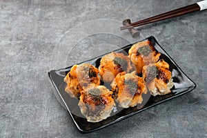 Dimsum with Japanese Mentai Sauce. Served on plate.