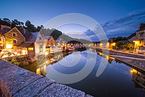 Dinan and Medieaval Stone Houses Reflecting in Rance River at Dusk in Summer in Bretagne, Cotes d`Armor, France photo