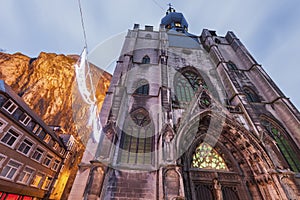 Dinant Citadel and Notre Dame Church at dusk