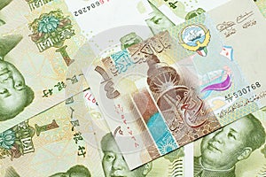 A dinar bank note from Kuwait with Chinese one yuan bills