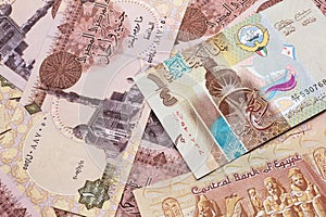 A dinar bank note from Kuwait with Egyptian one pound bank notes