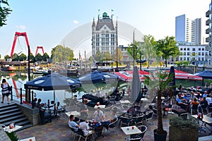 Diners enjoying alfresco dining with a view of the Witte Huis (White House) at Wijnhaven