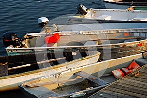 Dinghies are moored at a harbor