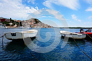 Dinghies moored at island