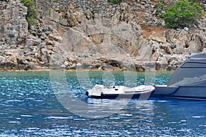 Dinghy boat near the luxury yacht