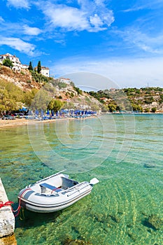 Dinghy boat on turquoise sea water at Pythagorion beach, Samos island, Greece