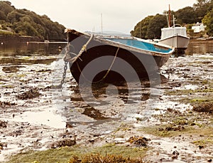 Dinghy in the mud at Pill Creek