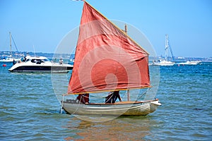 Dinghy sailing at Studland Bay.