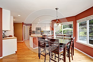 Dining area connected to kitchen room with tile counter top